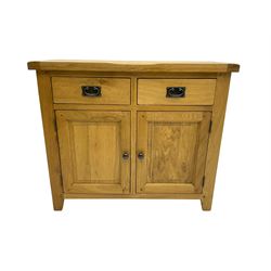 Solid light oak sideboard, fitted with two drawers and two cupboards