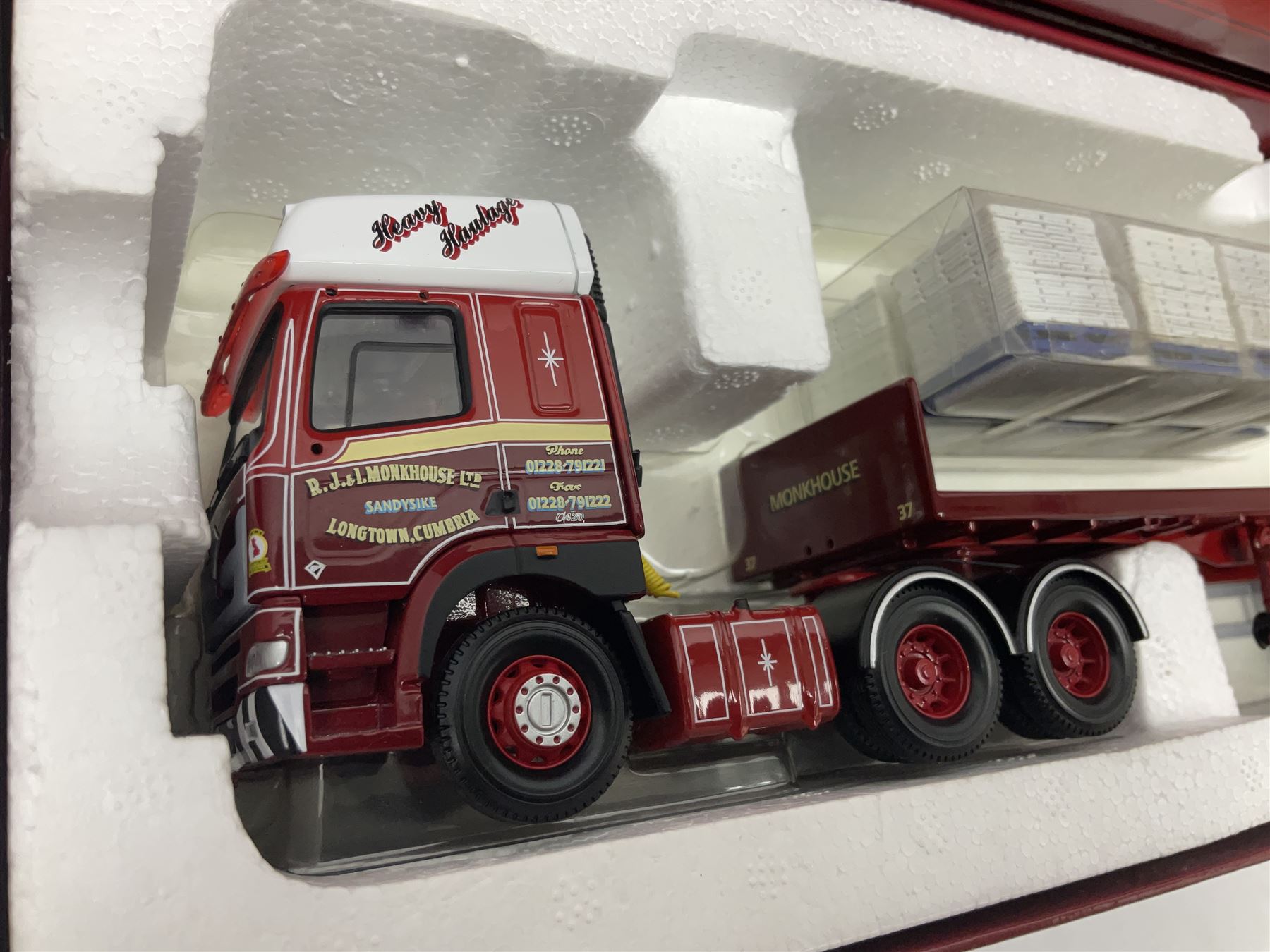 Corgi - three limited edition Hauliers of Renown lorries; CC13715 Scania R Series Topline Houghton Parkhouse 'The Professional' Livestock Transporter Chris Waite Transport; CC13812 Mercedes-Benz Actros Curtainside Eddie Stobart Ltd/Knauf; and CC13911 Foden Alpha Flatbed Trailer & Peat load R.J. & I. Monkhouse Ltd; all boxed with slipcases (3)