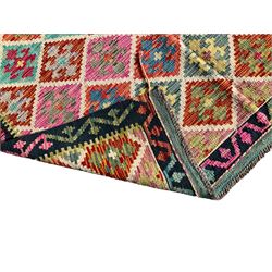 Anatolian Turkish Kilim multi-colour rug, decorated with all over geometric lozenges , the banded black border with repeating coloured patterns