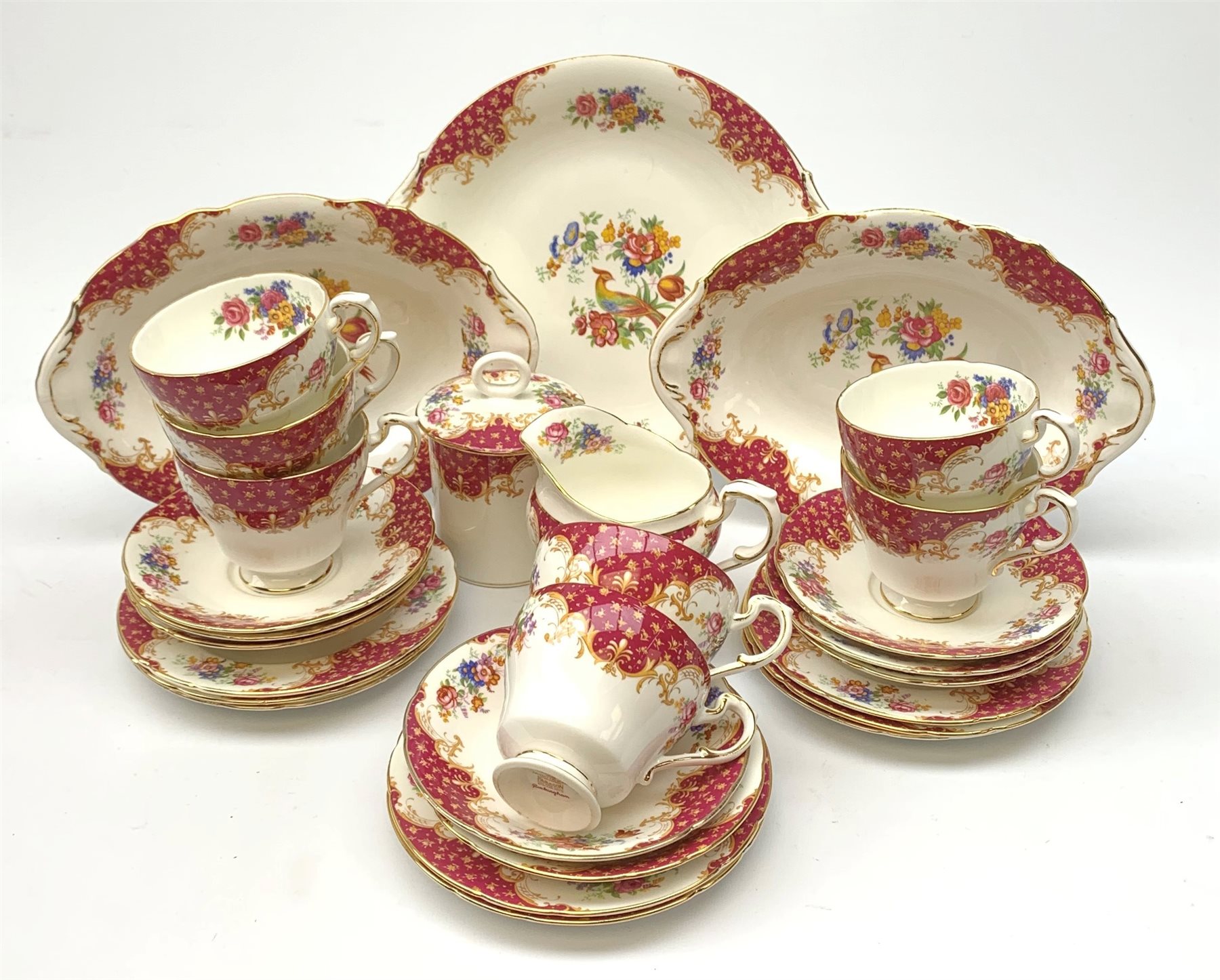 A Paragon Rockingham pattern tea set, comprising seven teacups and eight saucers, eight side plates, sucrier and cover, milk jug, sandwich plate, and two oval dishes. 