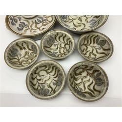 John Egerton (c1945-): studio pottery stoneware, comprising twin shallow covered dish, serving bowl and eight dessert bowls, all decorated with flowering sprigs on a cream ground, dish D28cm