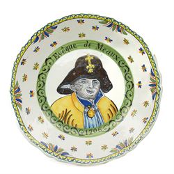 Set of four French Nevers style revolutionary faience plates, the first painted with a portrait of 'Evêque de Meaux' or the Bishop of Meaux,  another decorated with a putto holding a flaming torch and a flag inscribed 'W Lamour' beneath a slogan 'Cest le moment de faire un petit enfant' or 'Now is the time to make a child', another decorated with 'Vive les bons citoyens' or 'Long live the good citizens' within foliage, and another with a portrait of an officer, probably Napoleon, with the phrase 'Vive la Nation' or 'Long live the Nation', each bearing dates, with indistinct blue monogram to bases, D24cm (4)