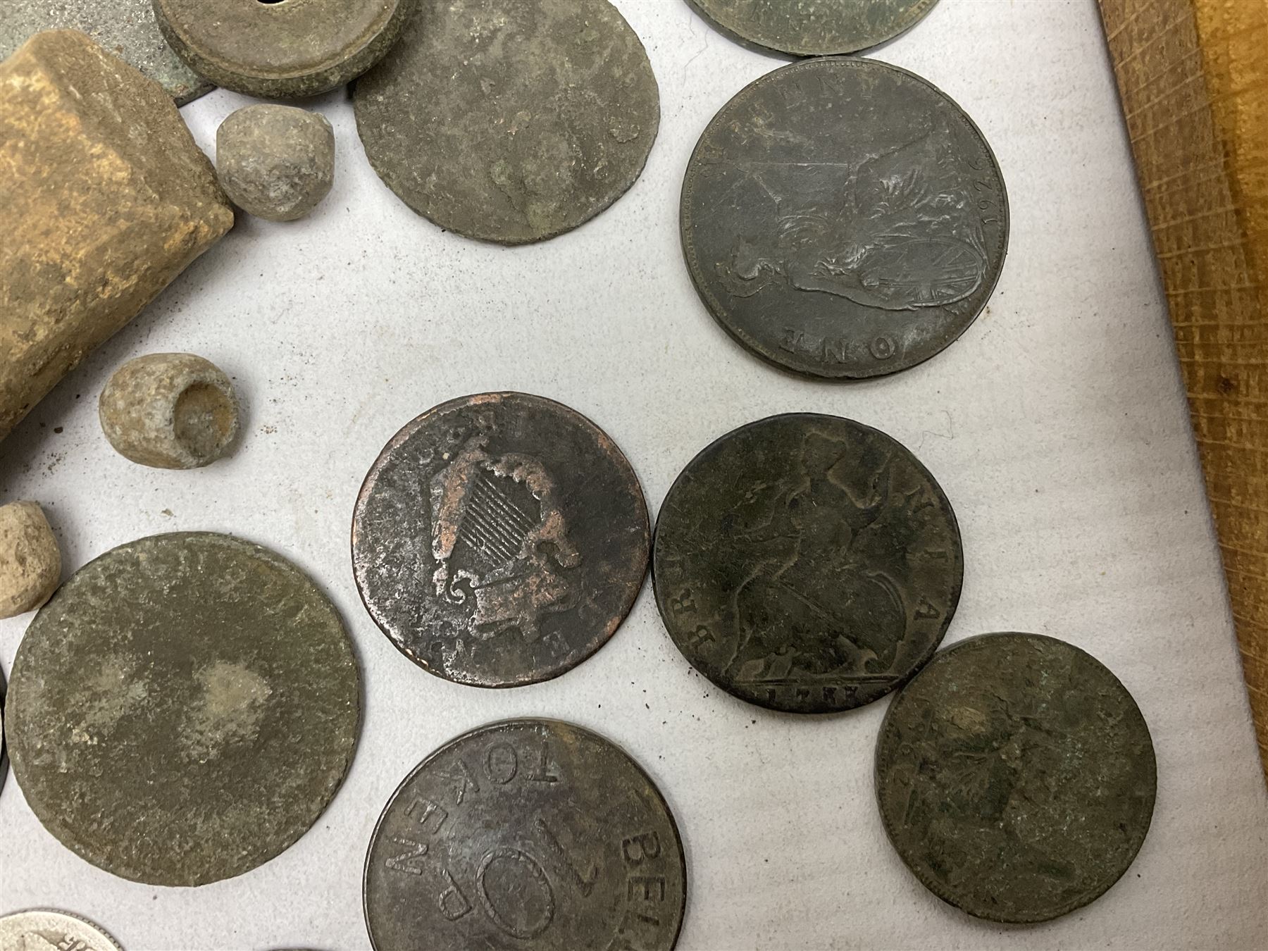 Collection of metal detecting finds and antiquities, housed on five display boards and some loose, to include coins, keys, axe head etc 
