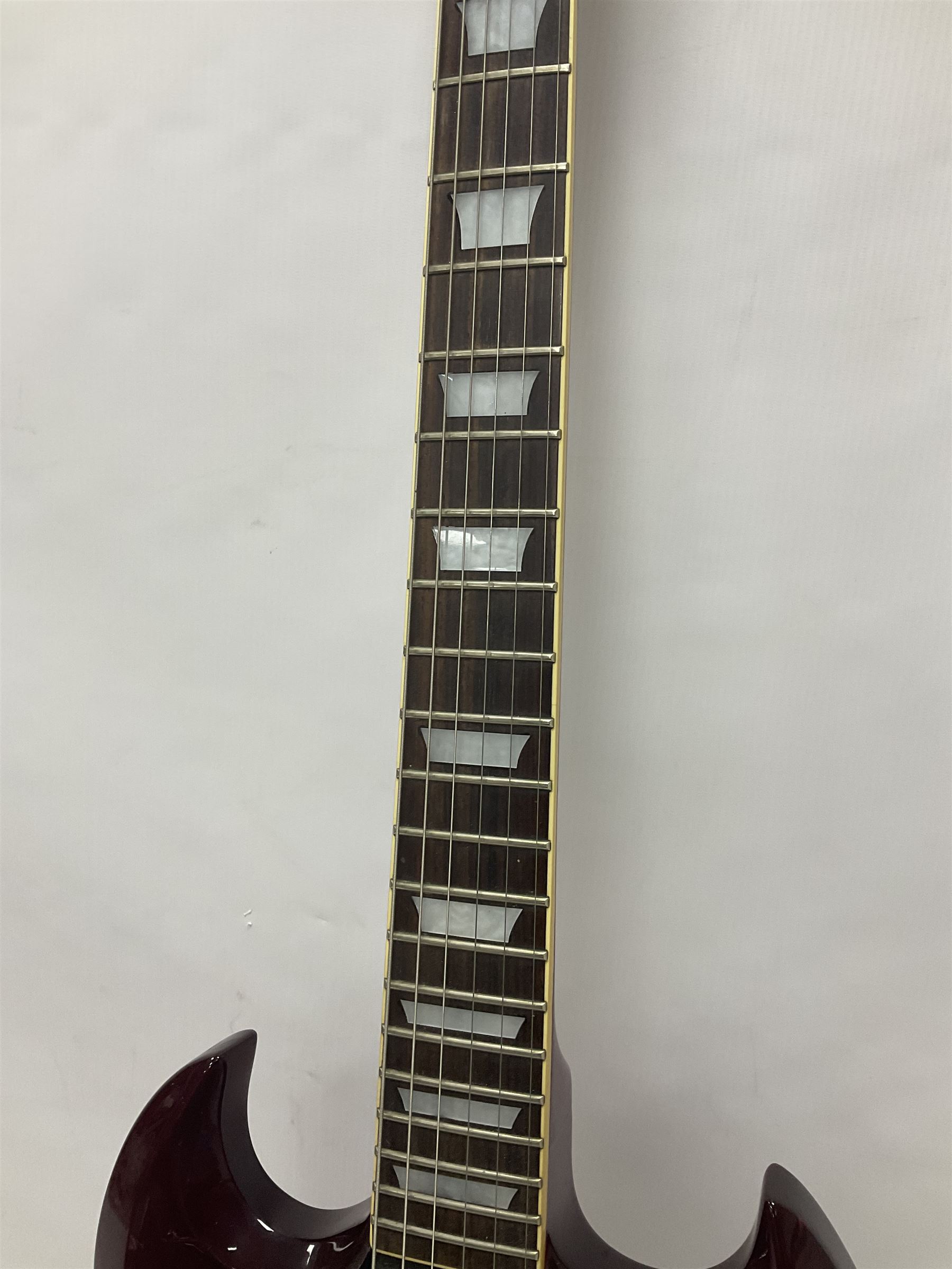 Gibson Epiphone SG six string electric guitar, with cherry red mahogany finish and black scratch guard, L102cm