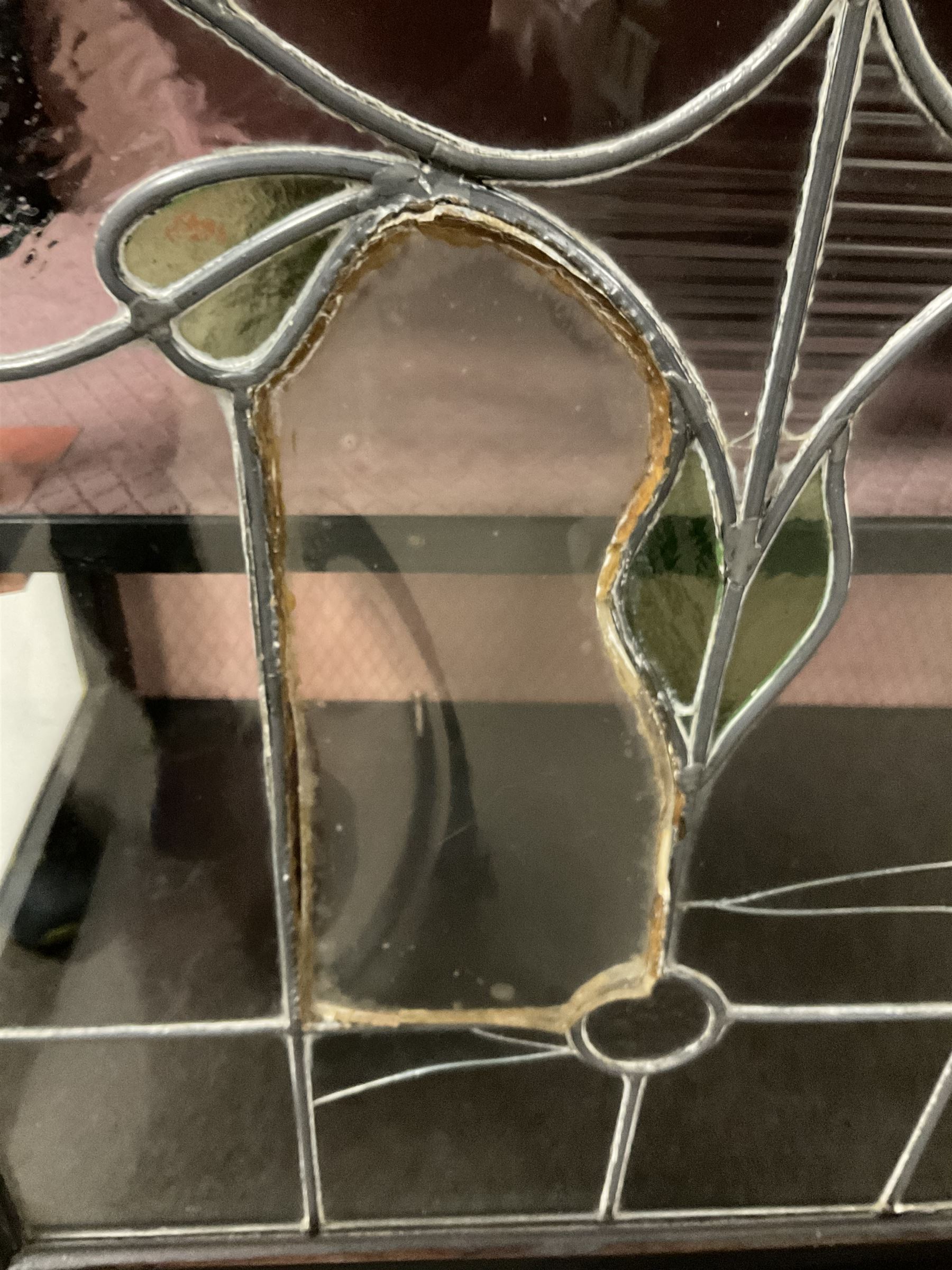 Late 19th century mahogany Empire style display cabinet, swan neck pediment and carved urn finial over two lead glazed doors enclosing two shelves, two glazed doors under, raised on cabriole front supports