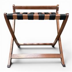 Ten walnut finish folding luggage stands