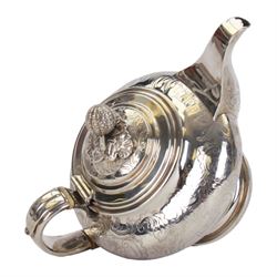 Victorian silver teapot, the body of bulbous form engraved with named cartouche and surrounded by flower heads and foliate scrolls, with capped strap handle with ivory insulator, and melon foliage mounted finial to the hinged lid, upon a circular stepped foot, hallmarked Francis David Dexter, London 1841, H17cm

This item has been registered for sale under Section 10 of the APHA Ivory Act