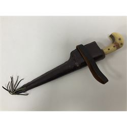Afghan Khyber knife (Choora), blade engraved along the top edge with ornate brass and bone grip, with leather scabbard, overall L31cm, blade L20cm