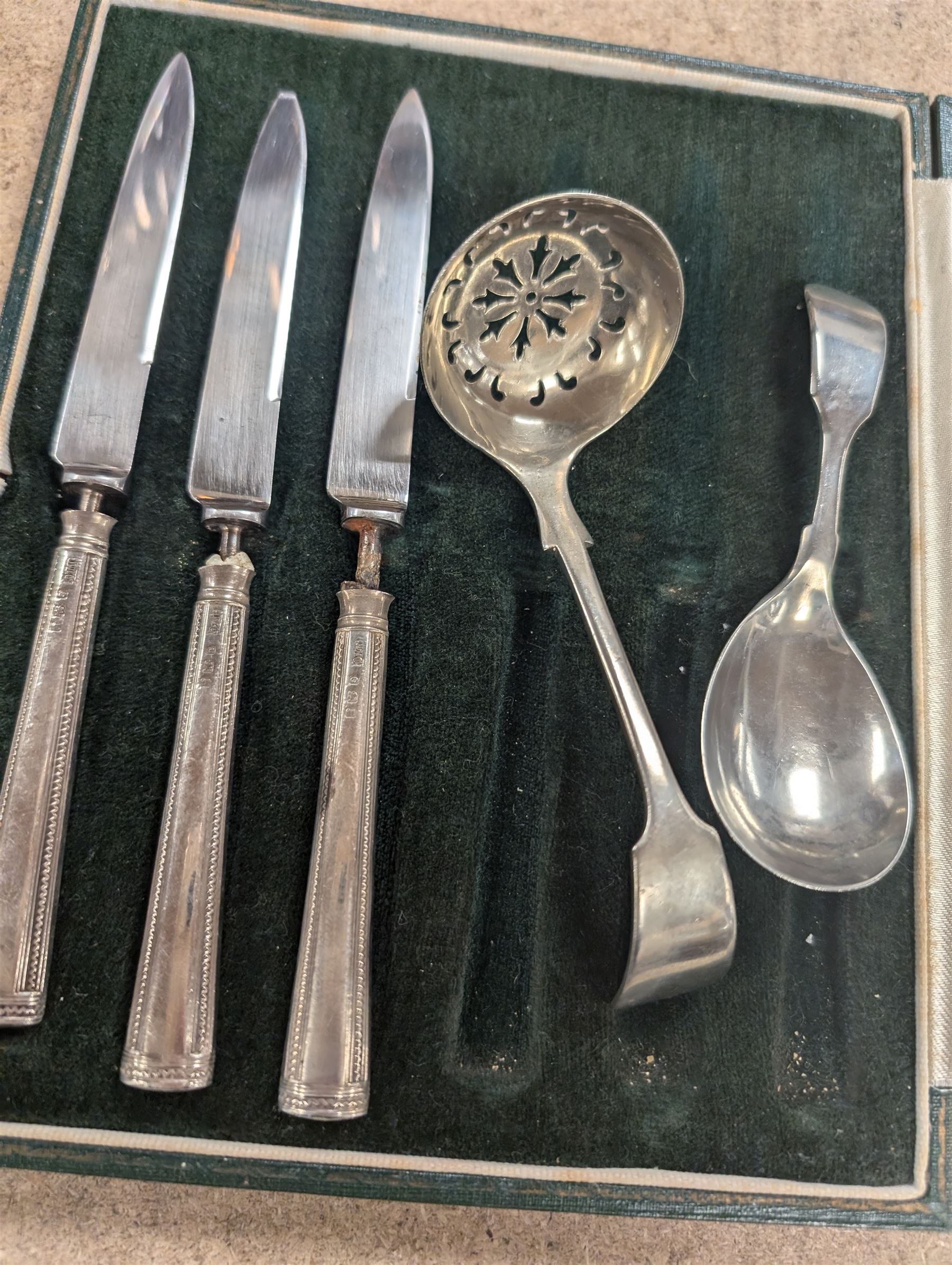 Two silver mounted button hooks and a shoe horn, three silver handled knives, silver hand mirror mount, two silver plated trophies, etc 