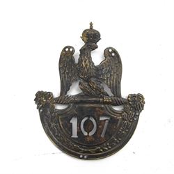 Napoleonic 1814 shako plate, for 107th Infanterie de ligne, in the form of crowned Imperia...