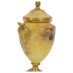 Coalport pedestal vase and cover, of urn form hand painted with fruit with gilt detail, signed J Mottram, H18cm