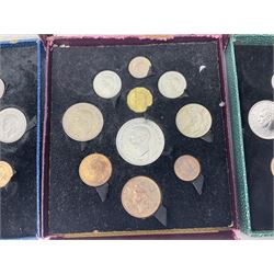 Three King George VI 1951 'Festival Of Britain' specimen coin sets, each comprising farthing to crown coins, housed in maroon, green and blue dated boxes 