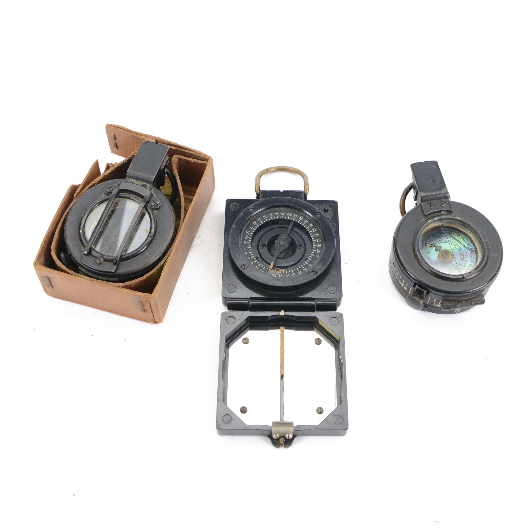 WWII three T.G & Co compasses, comprising two MKIII military compasses, dated 1940 and 1945 and Magnetic Marching Compass, Mark 1