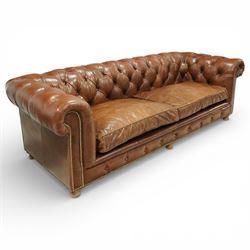 Timothy Oulton for Halo - three seat chesterfield sofa, deep button tufted back and arms in tan leather, loose seat cushions, studded detail to the scrolled arms and lower frieze, raised on turned bun feet