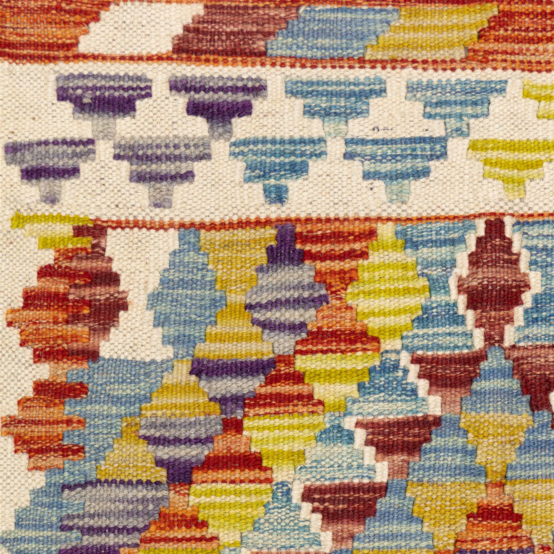 Two Chobi flatweave kilims with a repeating stepped diamond medallion design in live green, rust, teal, purple, and ivory, framed by chevron and geometric borders, 121x80cm & 87x60cm 