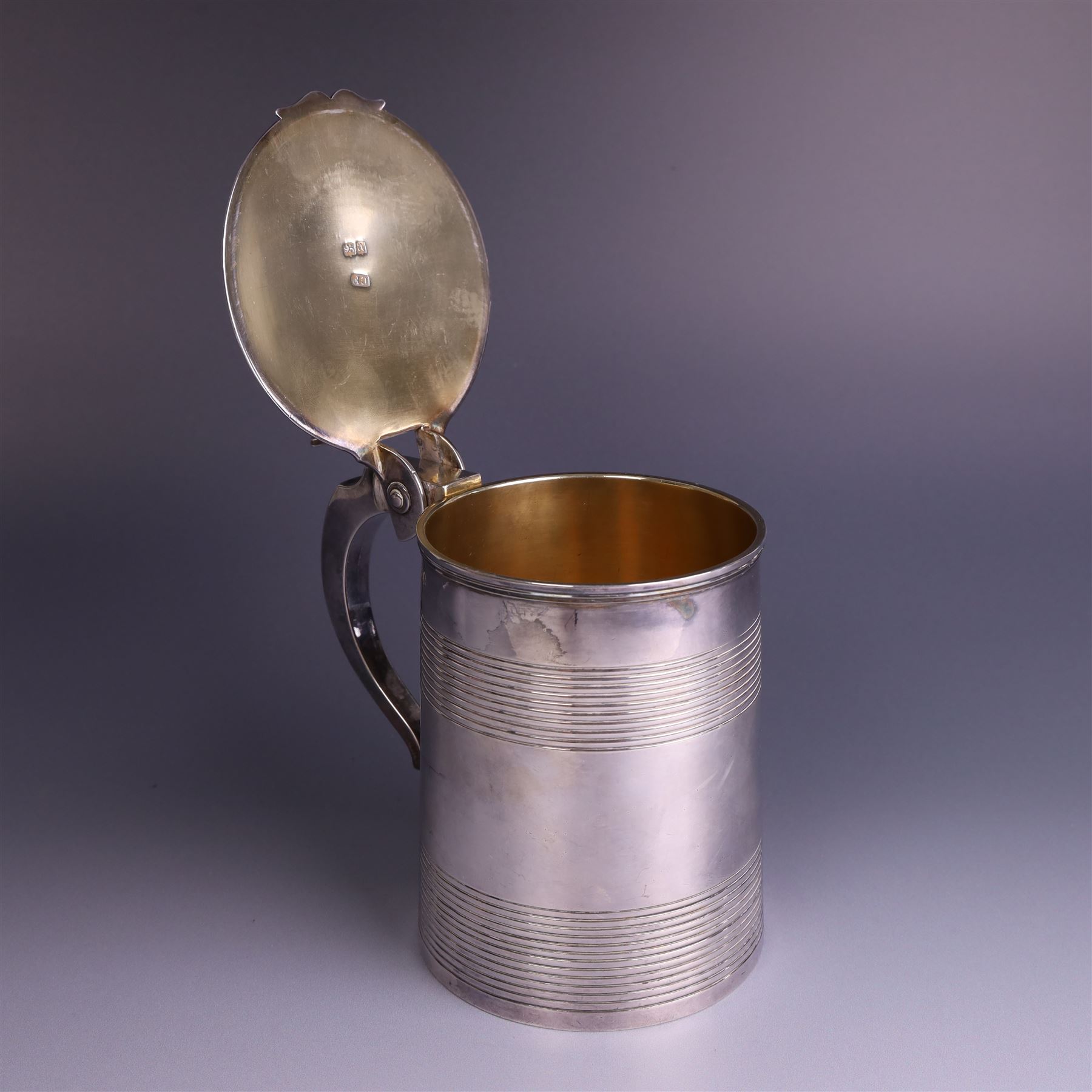 George III silver lidded tankard, with two ribbed bands to the cylindrical body, the hinged lid with concentric circle to cover and pierced thumbpiece, hallmarked Charles Fox I, London 1816, including thumb piece H16cm