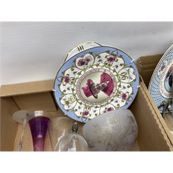 Floral ceramic table lamp with goat masks, together with collectors plates, Wade bell shaped decanters, art glass, colourful drinking glasses and other ceramics and glassware, in eight boxes 