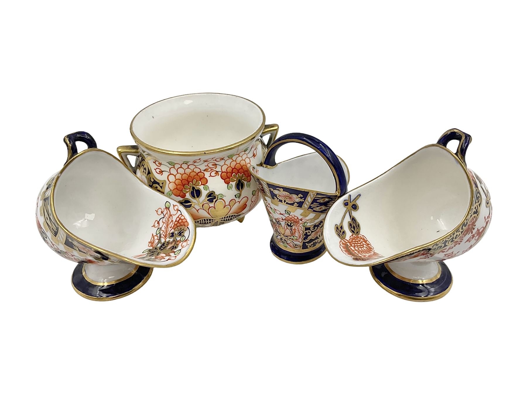 Group of Crown Derby and Royal Crown Derby Imari pattern miniatures, including mid 19th century Stevenson and Hancock cauldron, with painted mark beneath, H5.5cm, a near pair of early Royal Crown Derby scuttles, decorated in the 6299 pattern, each with printed and painted marks beneath including illustration date codes for 1913 and 1922, tallest 6.5cm, and a further early 20th century Royal Crown Derby scuttle, decorated in the 6299 pattern, with printed and painted marks beneath including illustration date code for 1922, H5.5cm, (4)
