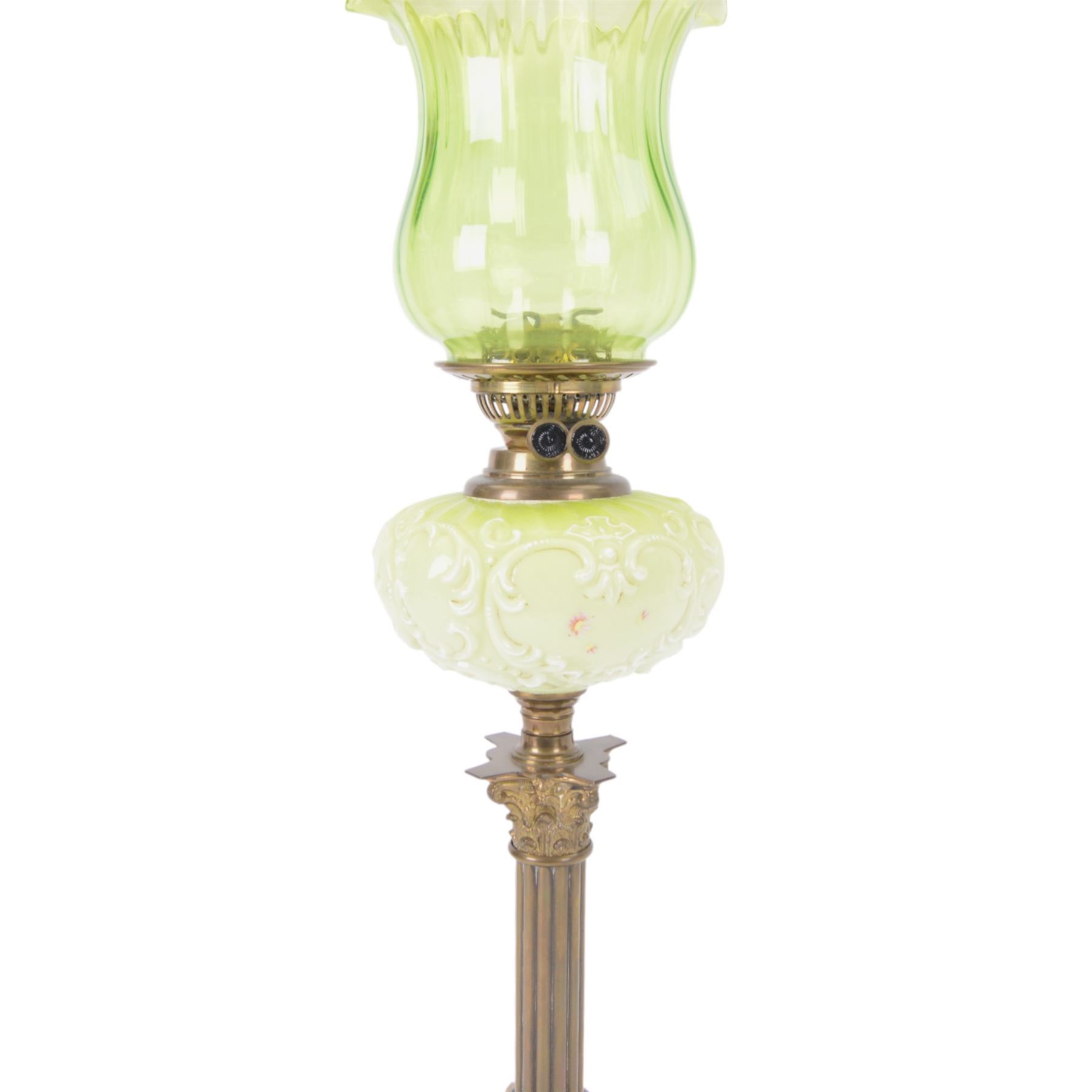 Green glass and brass oil lamps, with frilled glass shade, reservoir decorated with flowers, upon corinthian column with square base, H74cm