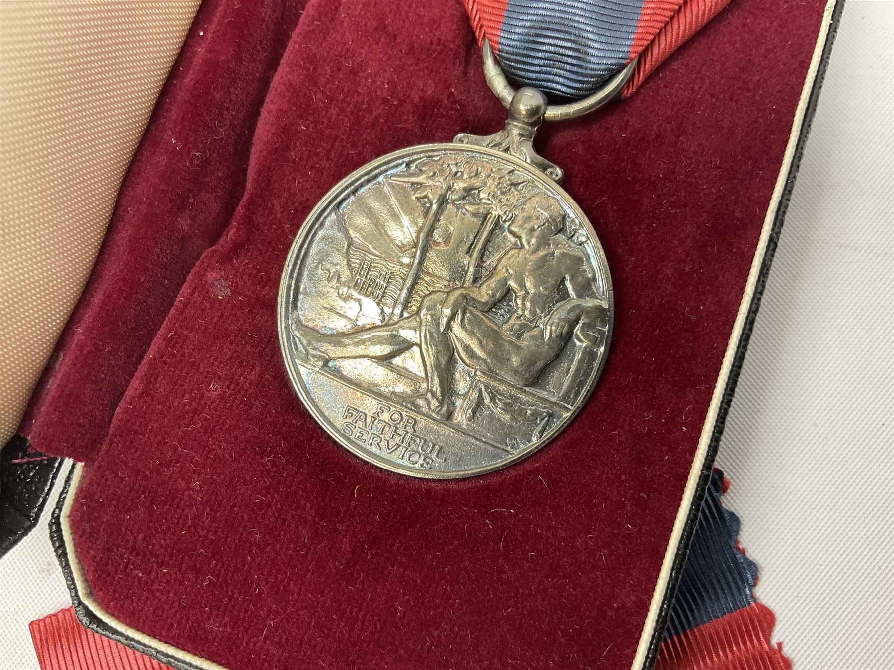 WW1 group of three medals comprising British War Medal and Victory Medal in issue box and Ceylon Volunteer Service Medal awarded to 10288 Pte. M. Smith R. Fus.; together with a later awarded WW2 Defence Medal in modern box with slip; and his QEII Imperial Service Medal in case and box with certificate dated 1959