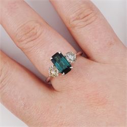 Platinum green tourmaline and diamond three stone ring, single octagonal cut tourmaline of 1.54 carat, with a single round brilliant cut diamond set either side, stamped Plat 950, total diamond weight 1.06 carat