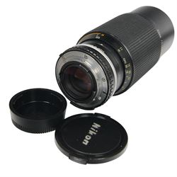 Two Nikon FM camera bodies, comprising Nikon FM serial no. 3239117, with a Nikon Series E 36-72mm 1:3.5 zoom lens and a Nikon FM2 serial no. 7141741, with a Nikkor 50mm 1:1.8 lens and a Nikon Series E 70-210mm 1:4 zoom lens