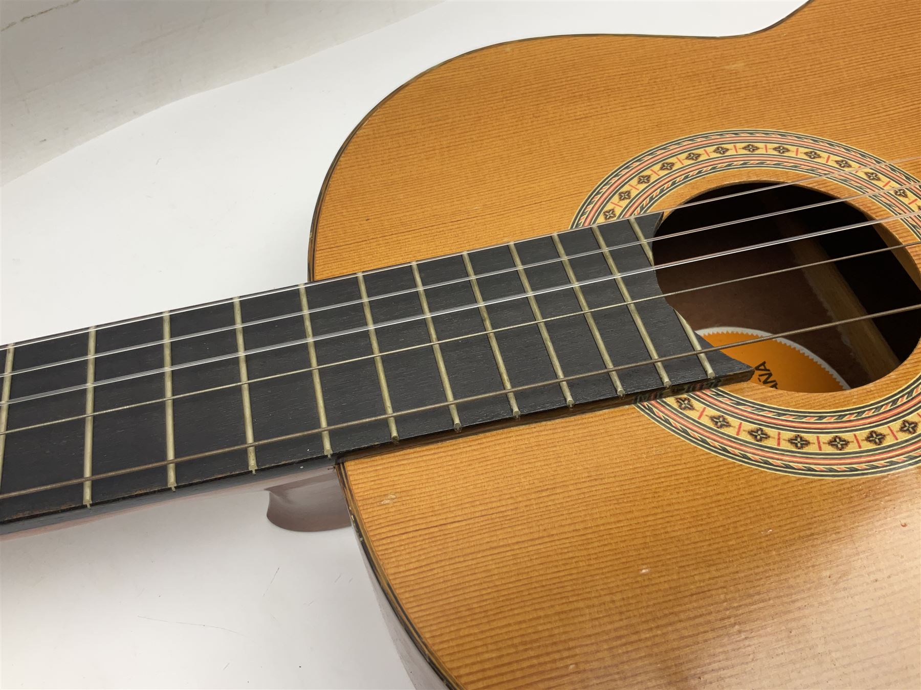 Spanish BM acoustic guitar with mahogany back and sides and spruce top L101cm; in cello carrying case; Roland foot pedal and two Yamaha foot pedals; tin D# organ pipe; folding music stand etc