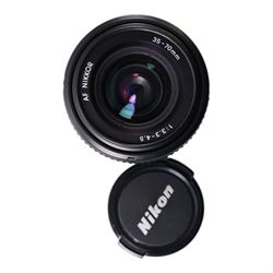 Eight camera lenses, comprising Canon Ultrasonic Zoom EF 75-300mm 1:4-5.6 lens, AF Nikkor 35-70mm 1:3.3-4.5 lens, Nikkor 60-180mm 1:4.5-5.6 lens, Canon Zoom EF 28-80mm 1:3.5-5.6 lens, Canon Zoom EF 80-200mm 1:4.5-5.6 lens, Sigma 70-300mm 1:4.6-5.6 DL Macro, Sigma Zoom 70-210mm 1:4-5.6 UCII lens and a Sigma AF 70-300mm 1:4-5.6 APO Macro lens, all with lens caps