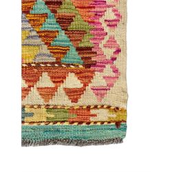 Tibetan-design handwoven rug, deep red field with three central medallions in yellow and blue, traditional yellow key border, white fringes on both ends