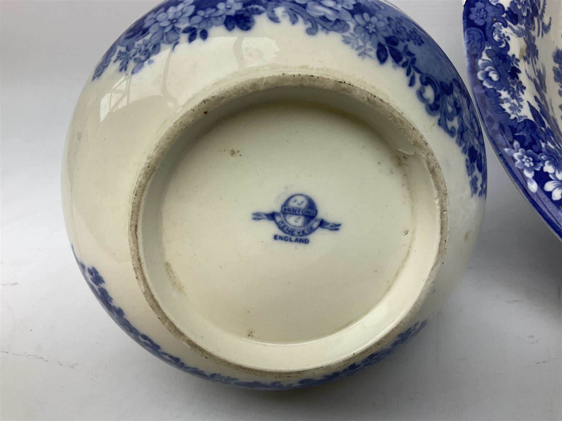 Mintons Genevese pattern wash bowl, jug and toothbrush holder, together with a similar Mintons blue and white soap dish, all decorated in the oriental style, all with printed marks beneath, largest D32cm