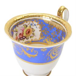 H&R Daniel trio, coffee cup, teacup and a saucer, circa 1825, Gadroon shape with D handle, painted with reserves of fine foliate sprays against a blue ground with gilt trellis detail, coffee cup including handle H8.5cm, saucer D14cm
