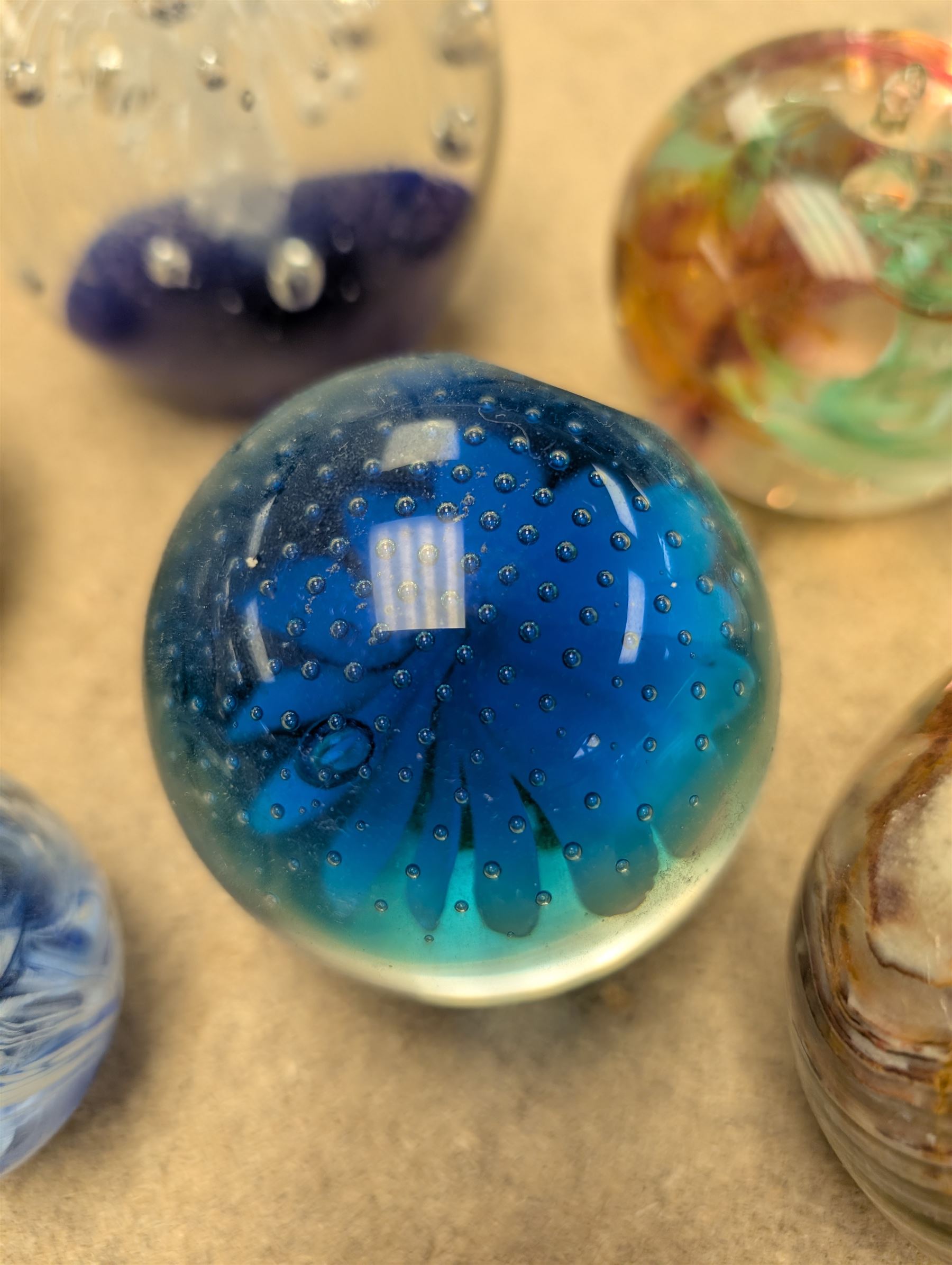 Collection of glass paperweights, including Caithness and Selkirk Glass