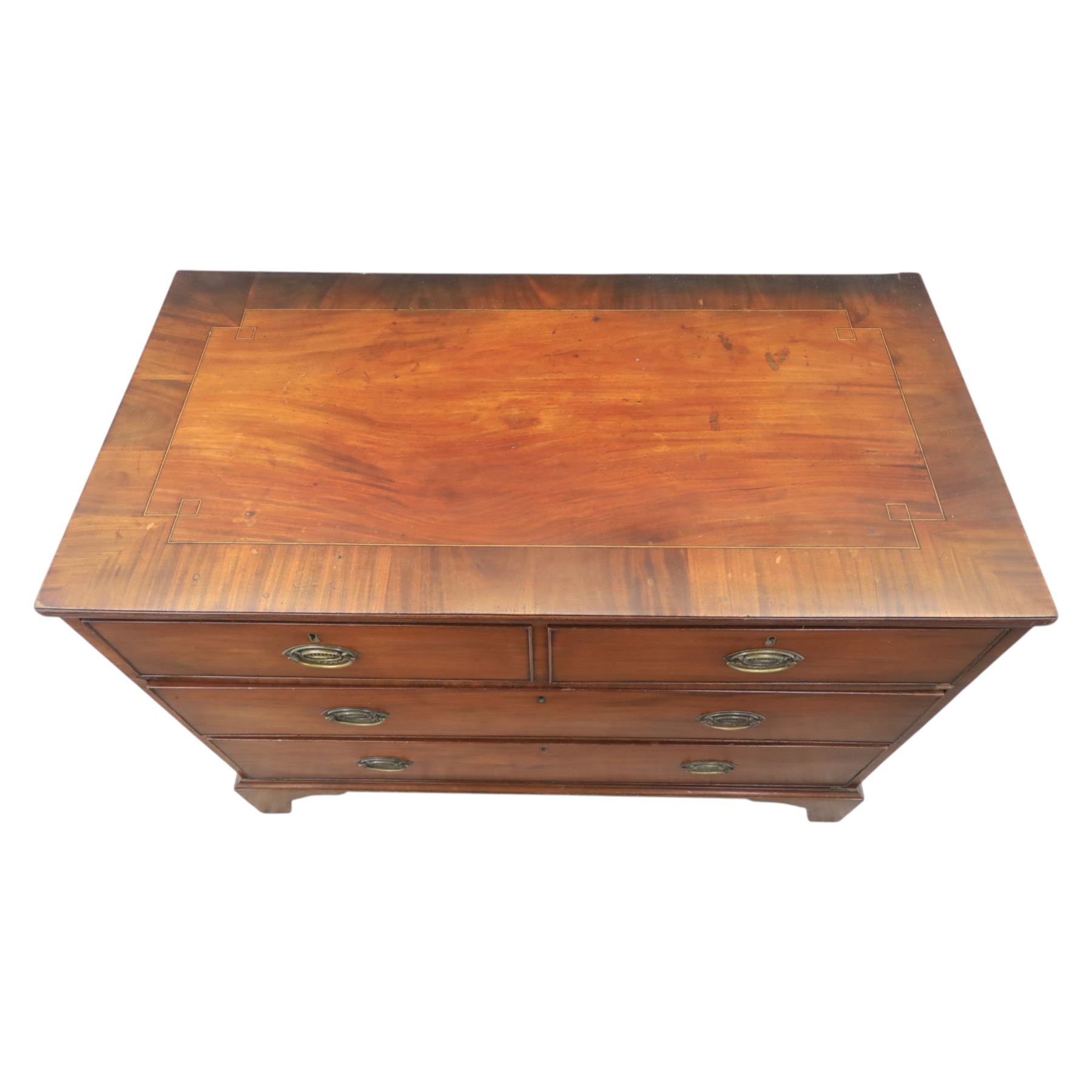 Early 19th century mahogany chest, fitted with short and two long drawers, crossbanded top, raised on bracket feet