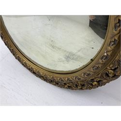 Gilt circular convex wall mirror, D61cm and a gilt chandelier