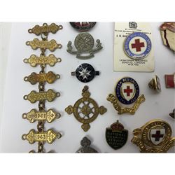 Collection of St John Ambulance enamel and metal badges, together with Red Cross medals and badges