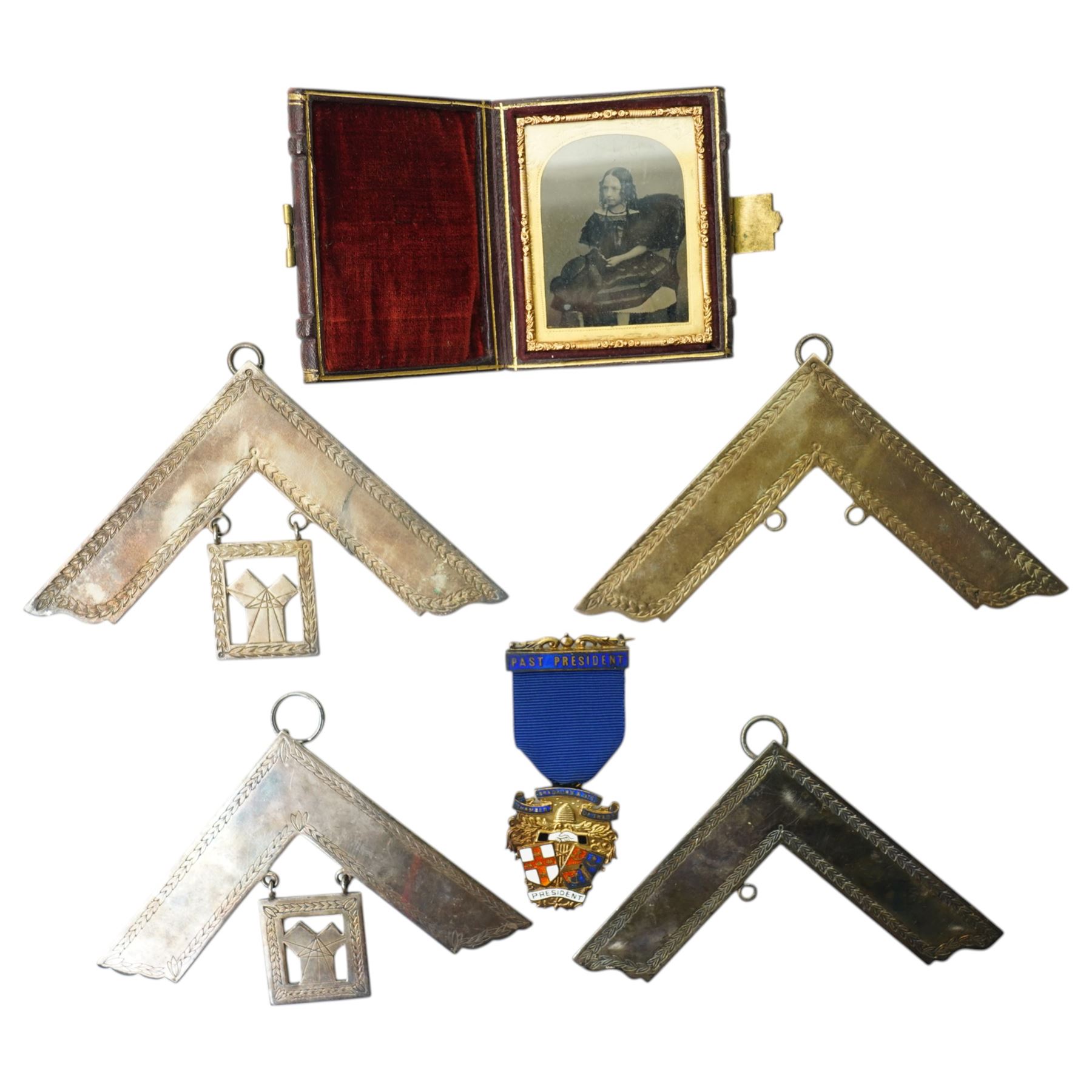 Masonic Jewels comprising seven enamel and gilt 'Lodge of Felicity', five dated 1945, four silver-plated examples collar jewels, a silver-gilt jewel, together with a cased Victorian photograph and a silver-gilt medal for 'Past President Chamber of Trade, Bradford & District', including some cases 