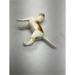 Beswick hunting group, comprising huntswoman on grey horse no 1730, huntsman on brown horse no 1501, two seated fox figures no 1748 and seven fox hounds, all with printed marks beneath (11)