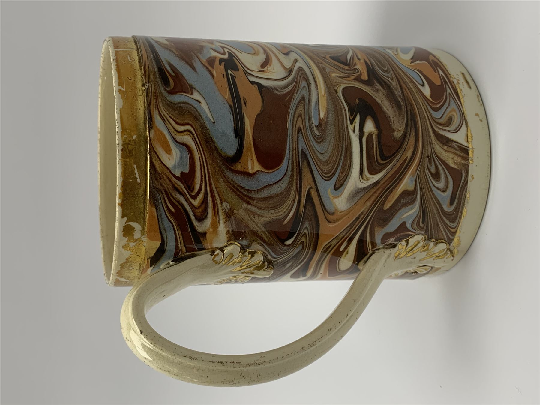 Late 18th century earthenware mug, possibly Ralph Wedgwood, Burslem or Ferrybridge, with surface marbled decoration and later gilt detail to rims and handle, impressed beneath Wedgwood & Co, H12cm