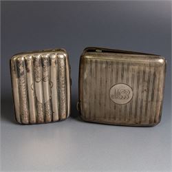 Two early 20th century silver cigarette cases, comprising a rectangular example with folia...