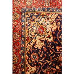  Mahal red and blue ground rug, central medallion with floral field, repeating border, 396cm x 298cm  