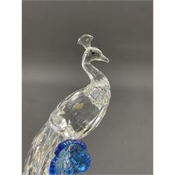 Swarovski Crystal animals, comprising white peacock, the tail with cascading blue flowers, perched eagle with yellow beak, ibex with frosted crystal horns and unicorn with frosted crystal horn, tallest H13cm