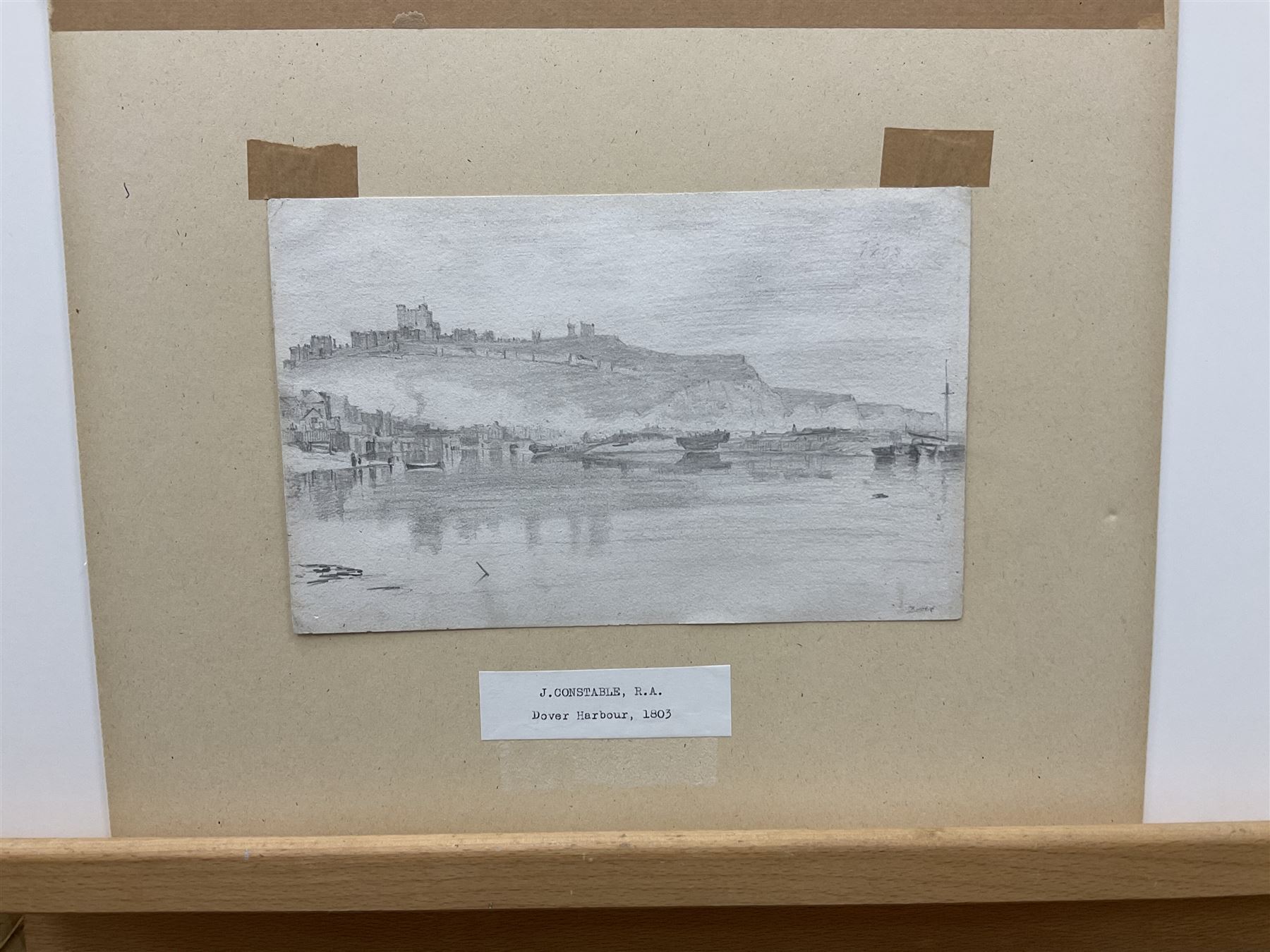 John Constable RA (British 1776-1837): 'Dover', pencil sketch titled and dated 1803, inscribed verso 14cm x 23cm 
Provenance: deceased estate/house clearance in the Leeds/York area, located in a suitcase with broken glass - back opened and glass replaced prior to auction. With The Little Gallery, 5 Kensington Church Walk, London W8, who were active around 1971-1975 specialising in big name artists but the pictures were often sketches, untypical works, thumbnail drawings etc (far more readily available at this period). There are many other examples of big name artist's pictures being sold with the same Gallery label in the same handwriting. The back of the drawing is inscribed 'J Constable' probably in the handwriting of John Fisher, his friend and patron, who on Constable's death dispersed many sketches and scrapbooks. Notes: Constable made a series of drawings, mainly of shipping, during his voyage on the East Indiaman 'Coutts' from London to Deal in April 1803. In a letter to his good friend John Dunthorne, dated 23rd May 1803, he writes 'I came on shore at Deal, walked to Dover (about one and a half hours) and the next day returned to London', giving him a half day in Dover.