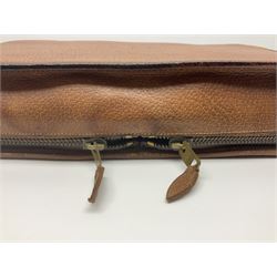 Mappin & Webb leather cased campaign gentleman's vanity set, the tan leather case opening to reveal fitted interior with five engine turned silver capped glass vanity bottles, hallmarked Mappin & Webb, London 1944, brushes, mirror etc, monogram DPK to the top of the case