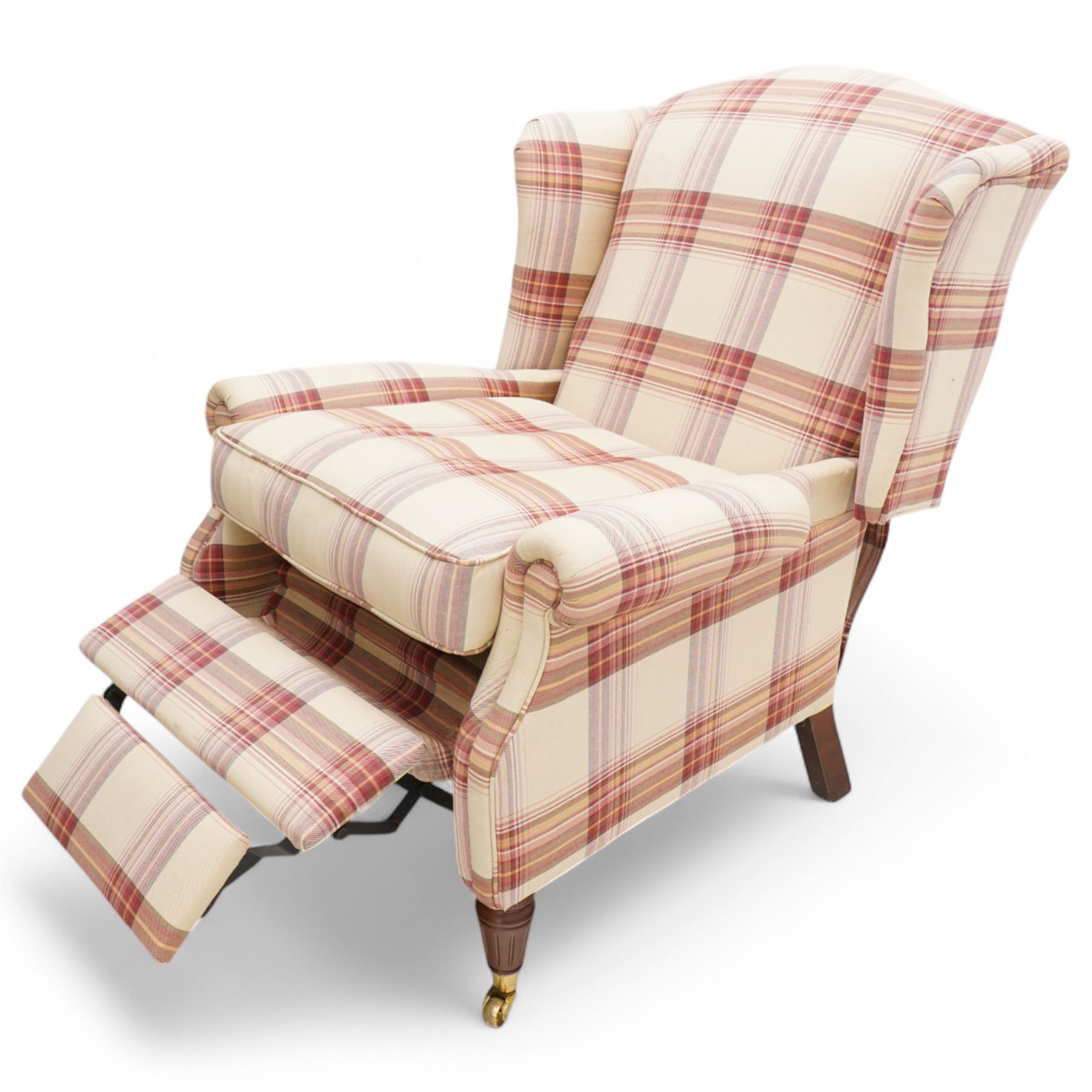 Laura Ashley - hardwood-framed wingback reclining armchair upholstered in checkered fabric, on turned and fluted front feet with brass cups and castors 