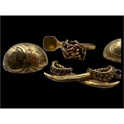 9ct gold charms, including crossed swords, signet ring, horseshoe and leaf, and a 14ct gold fireplace charm