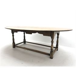 17th century style oval distressed light oak plank top dining table, rectangular stretcher base, L228cm, W150cm, H77cm