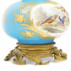 19th century French porcelain vase in the manner of Sevres, the reserves painted with birds within a landscape and floral bouquets, on a turquoise ground with gilt highlights, with ormolu style gilt metal collar and base, H26cm