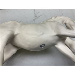 Five Beswick and Royal Doulton horse figures in matt white on black plinths, comprising of  Spirit of Affection no. 2689/2536, Springtime no.2837, Spirit of peace no.2916, Spirit of earth no.2914 and Spirit of the wild no. 183, together with a composite figure of a horse (6)