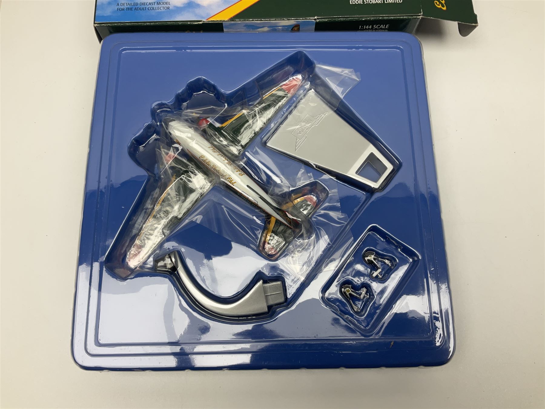 Corgi Eddie Stobart - four heavy haulage vehicles comprising 75201 ERF Curtainside; 75403 Leyland-DAF Curtainside; both in plastic display boxes; CC12610 Scammell Crusader 3 Axle Low Loader; and CC12502 Atkinson Borderer Flatbed Trailer; together with AA30008 Douglas DC-3 Aircraft; all boxed (5)