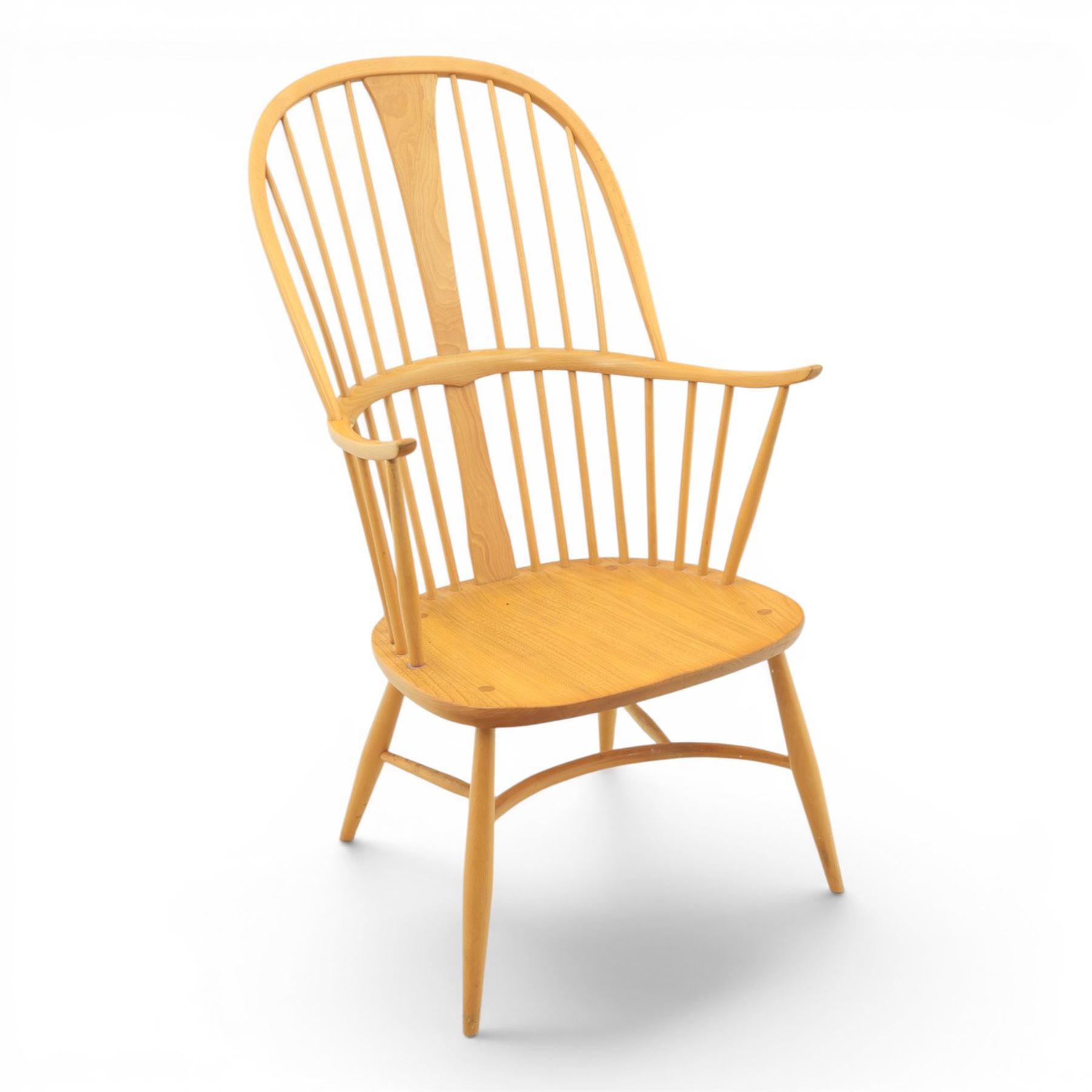 Ercol - Windsor 'Chairmakers' light ash armchair, with traditional spindle backrest, above a dished seat, with cylindrical supports united by a carolean stretcher